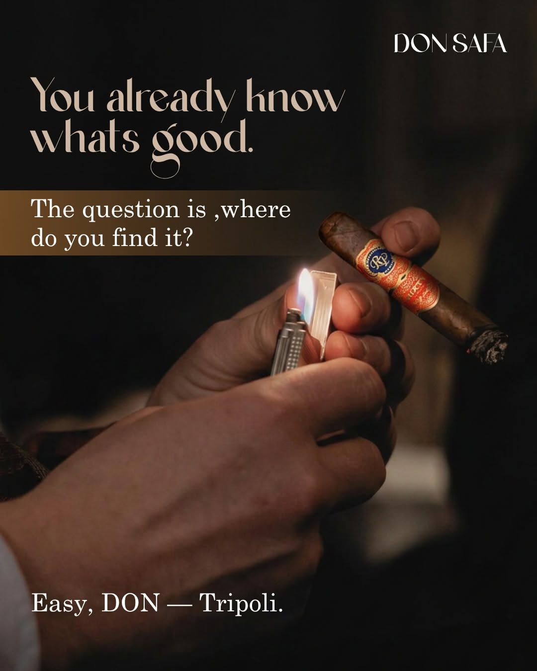Hands lighting a Rocky Patel cigar